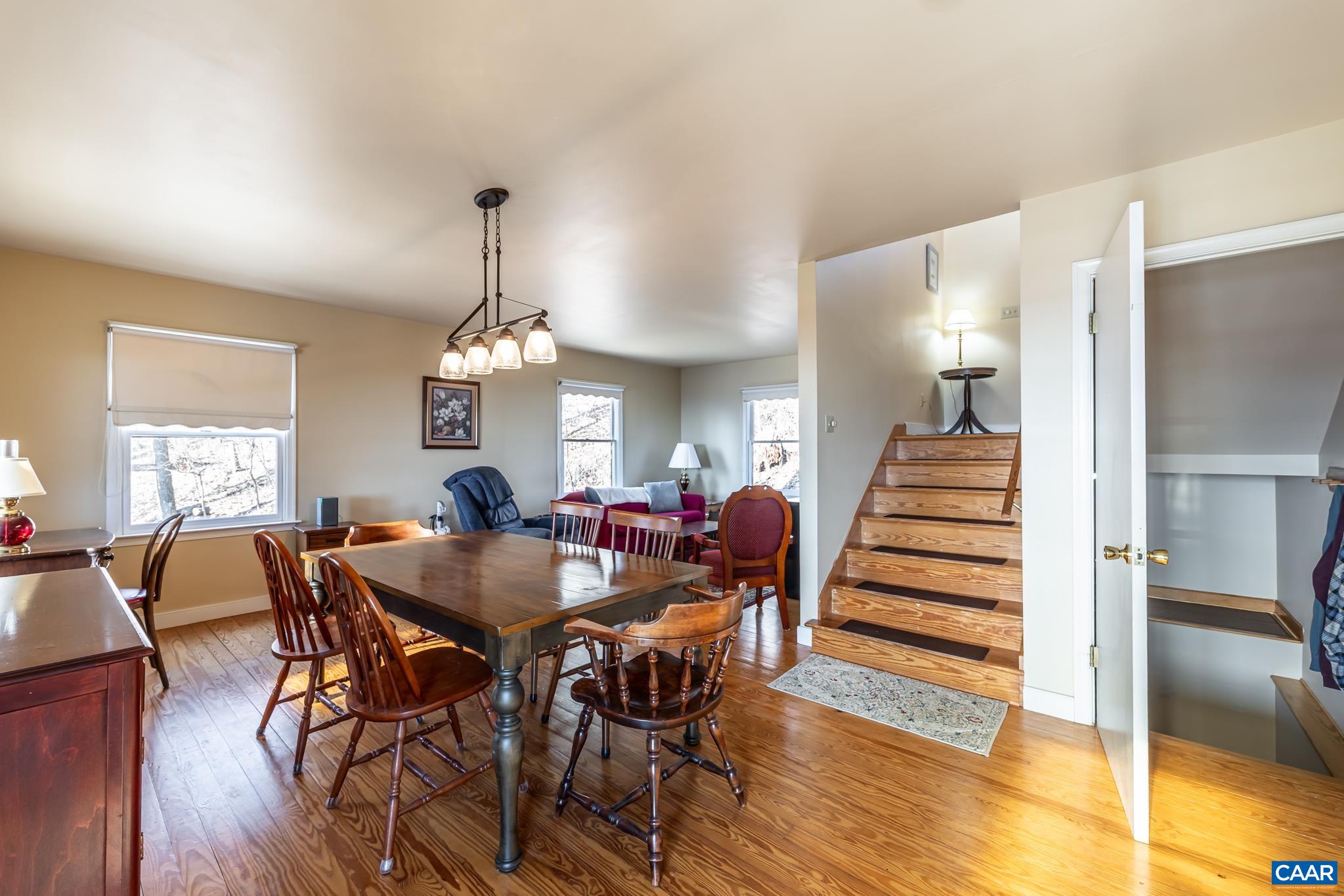 1022 Turkey Ridge Road Stanardsville, VA 22973 - Photo 27 of 74 a view of a dining room with furniture window and wooden floor