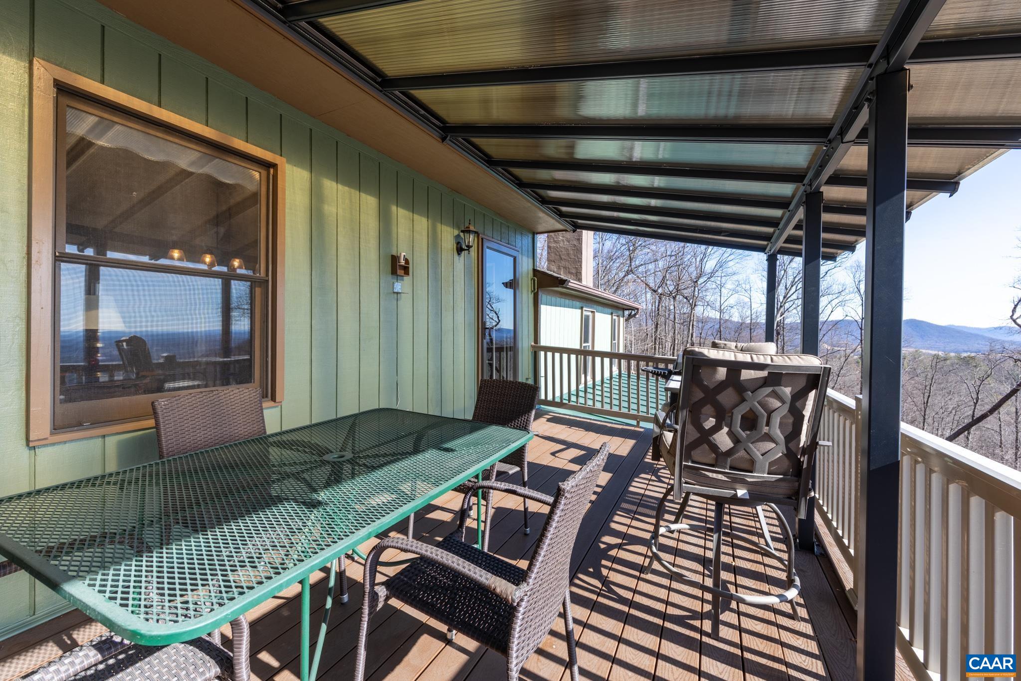 1022 Turkey Ridge Road Stanardsville, VA 22973 - Photo 30 of 74 a view of a balcony with chairs
