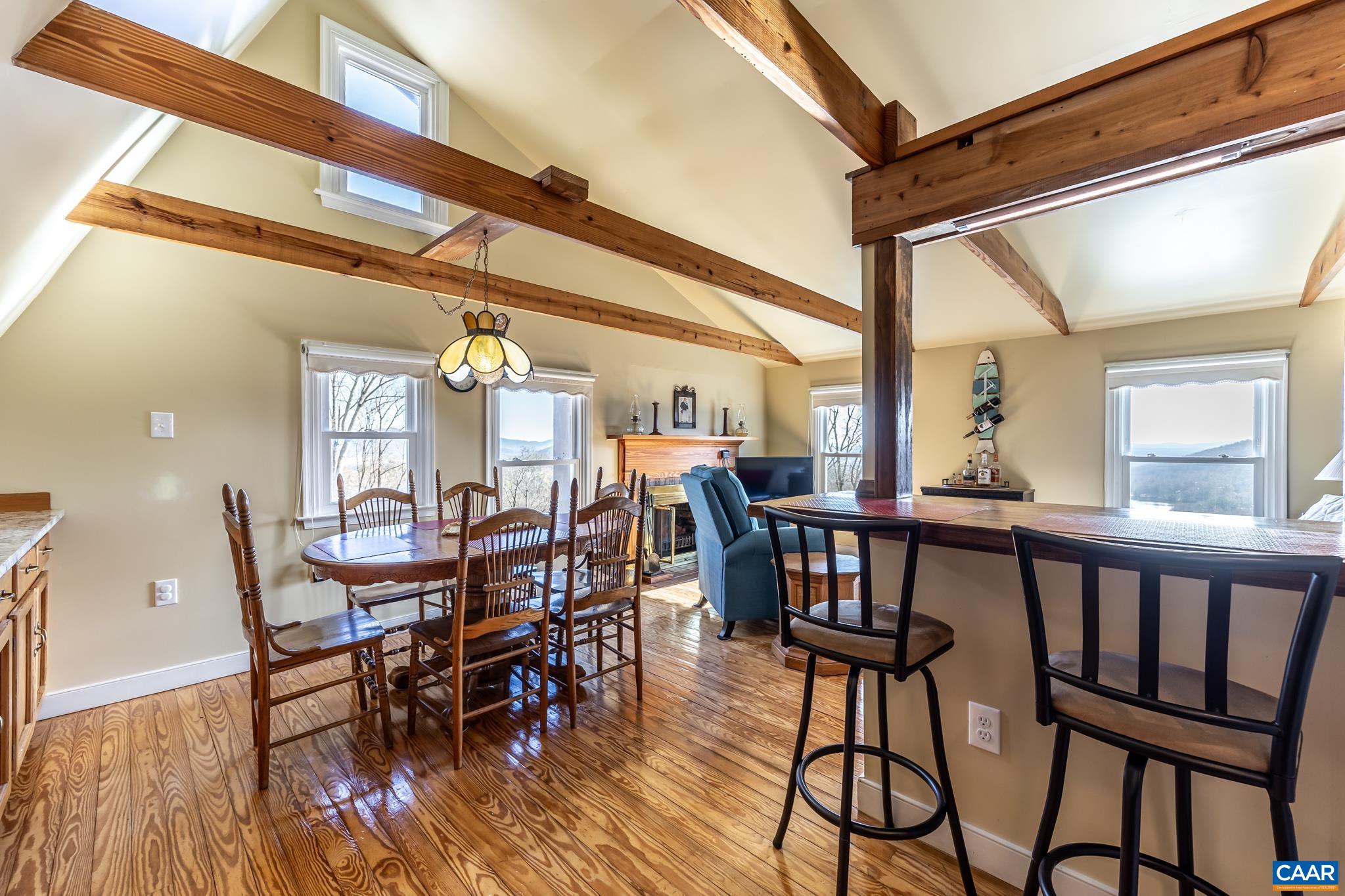 1022 Turkey Ridge Road Stanardsville, VA 22973 - Photo 42 of 74 a view of a dining room with furniture and wooden floor