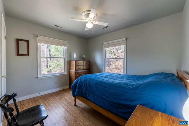 a view of a swimming pool with a yard