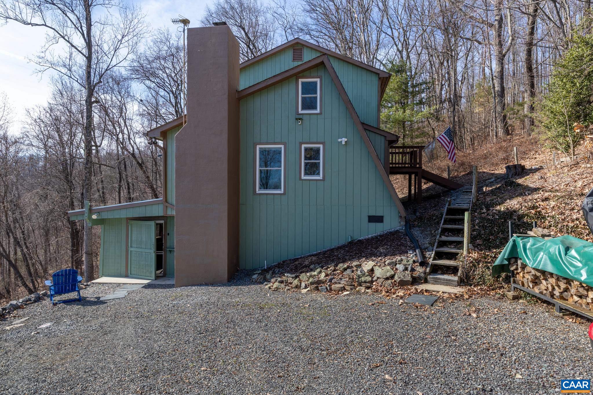1022 Turkey Ridge Road Stanardsville, VA 22973 - Photo 9 of 74 a front view of a house with a yard
