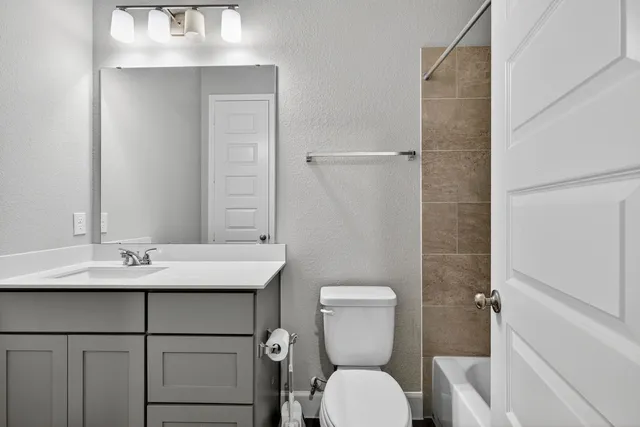 a view of an empty room with windows