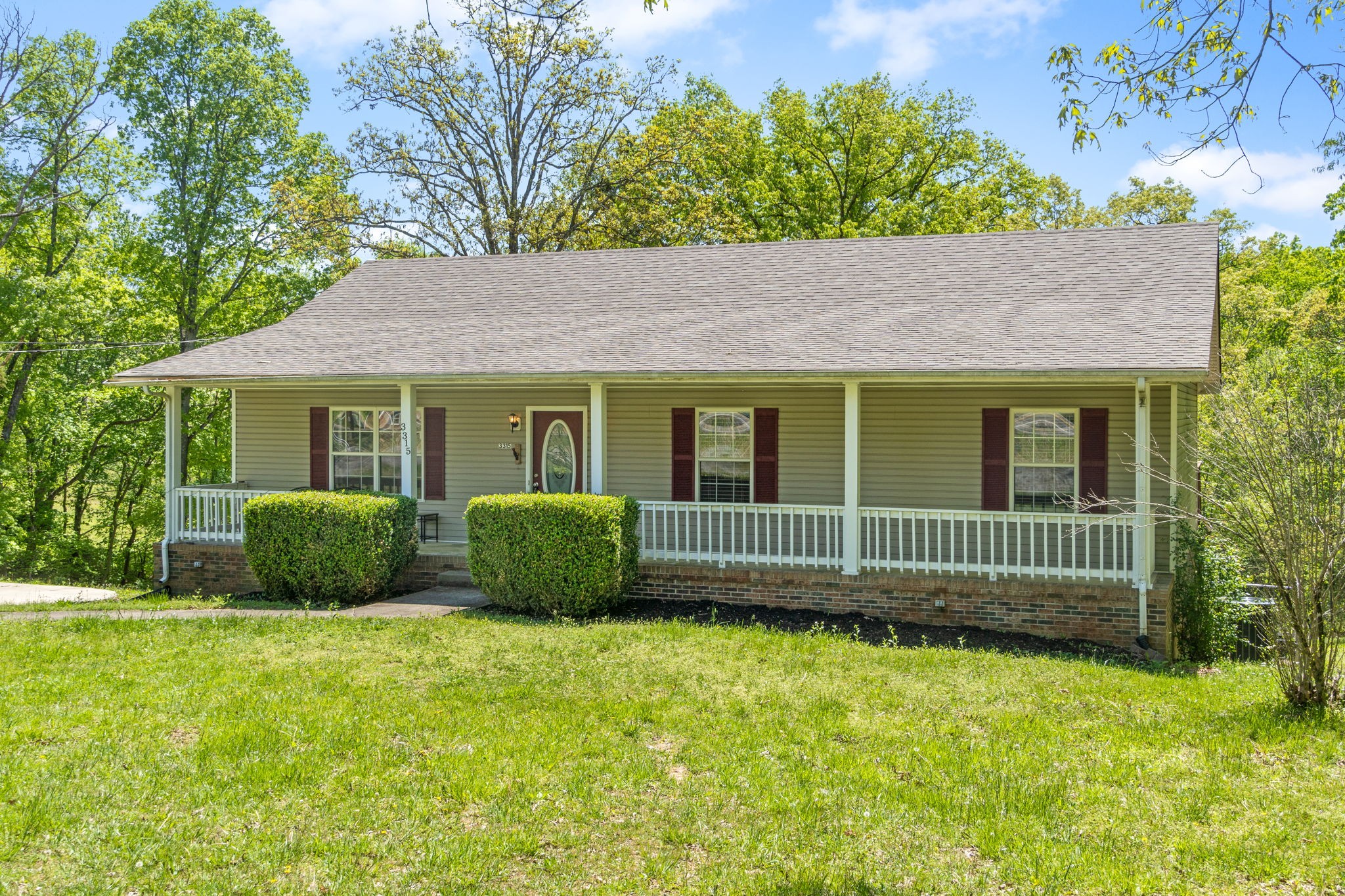 3315 Lylewood Road Woodlawn, TN 37191 - Photo 2 of 39 a house view with a garden space