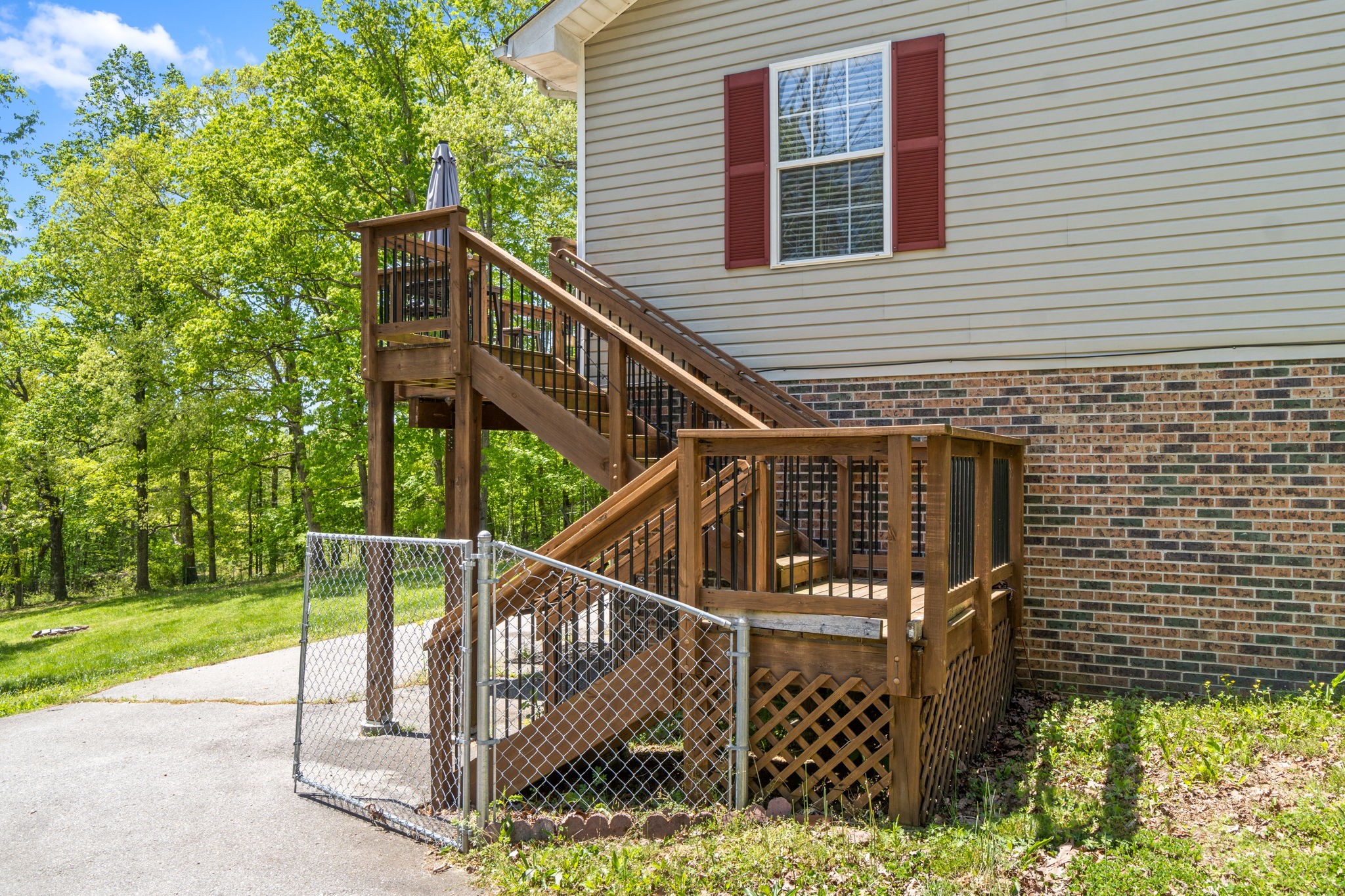 3315 Lylewood Road Woodlawn, TN 37191 - Photo 30 of 39 a view of a house with backyard and deck