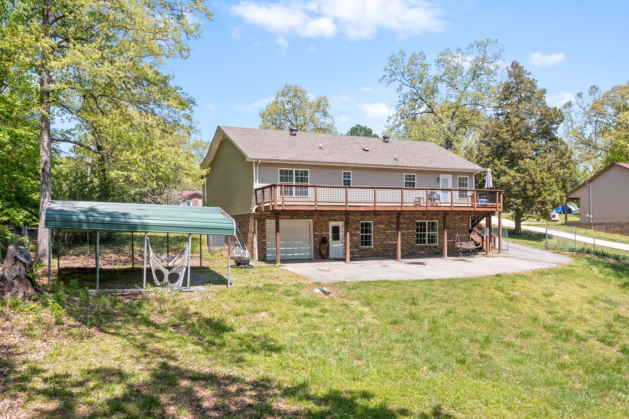 3315 Lylewood Road Woodlawn, TN 37191 - Photo 34 of 39 a view of a house with a yard balcony and sitting area