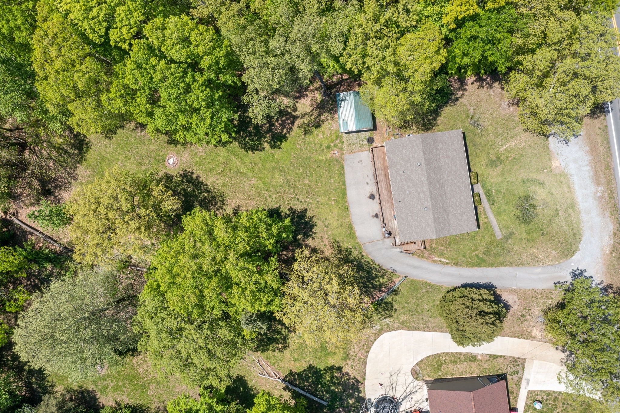 3315 Lylewood Road Woodlawn, TN 37191 - Photo 37 of 39 an aerial view of a house with a yard and large trees