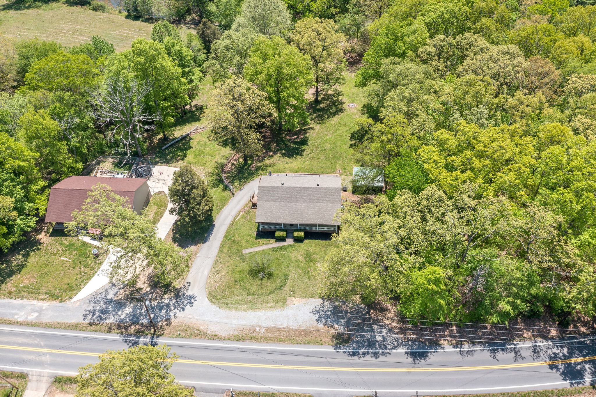 3315 Lylewood Road Woodlawn, TN 37191 - Photo 39 of 39 an aerial view of a house with a yard and potted plants