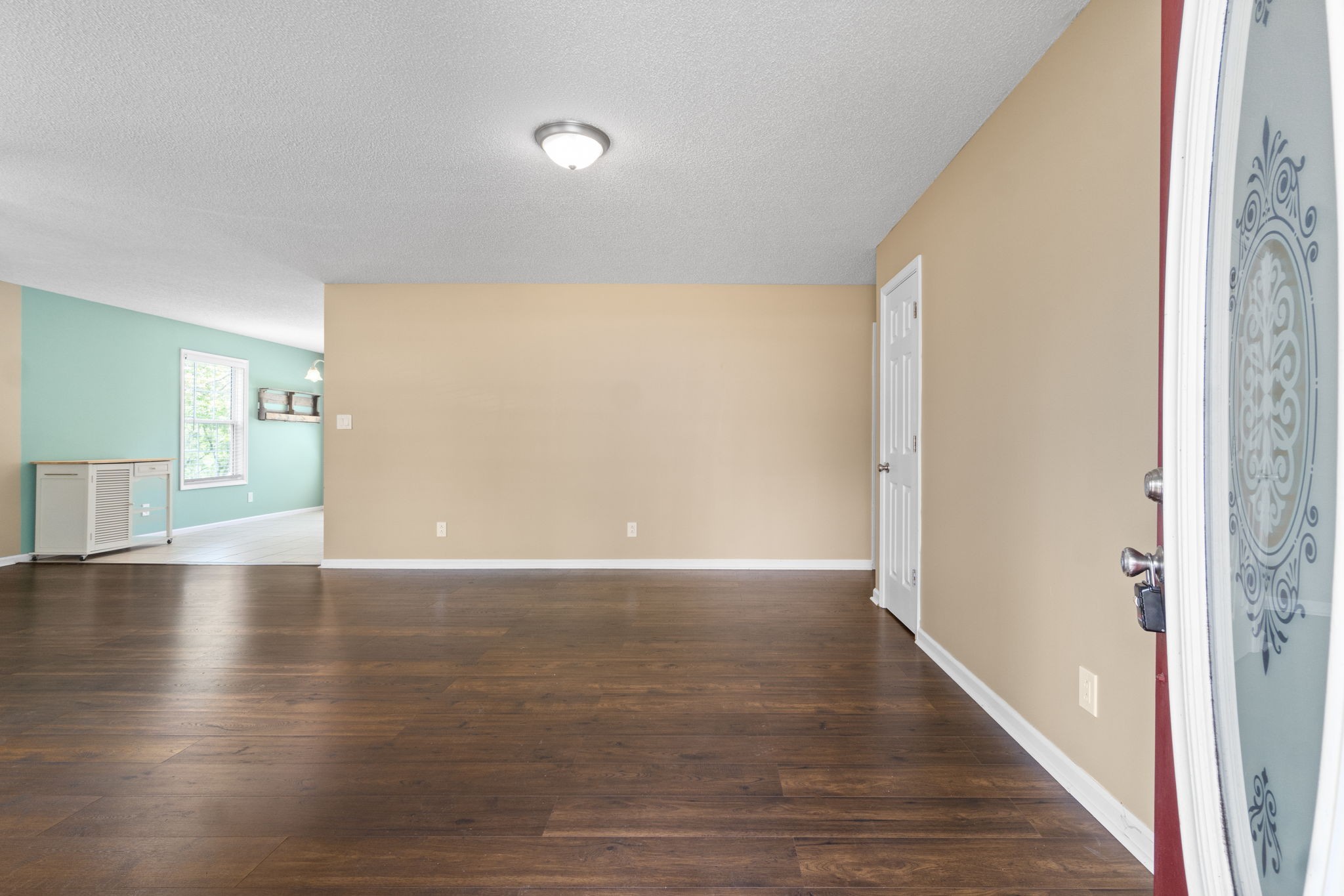 3315 Lylewood Road Woodlawn, TN 37191 - Photo 5 of 39 a view of an empty room with wooden floor and a window