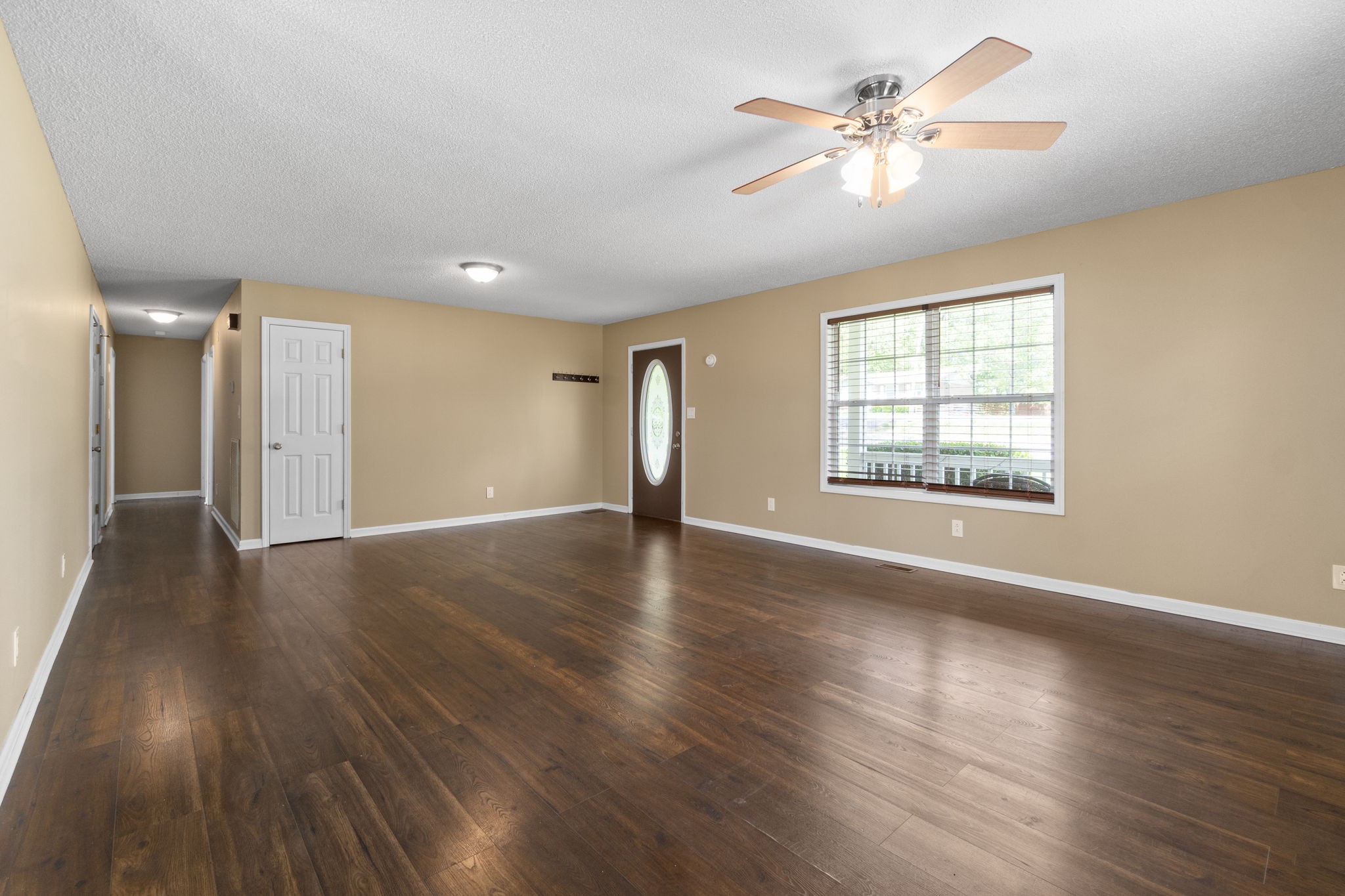 3315 Lylewood Road Woodlawn, TN 37191 - Photo 7 of 39 a view of an empty room with a window and wooden floor