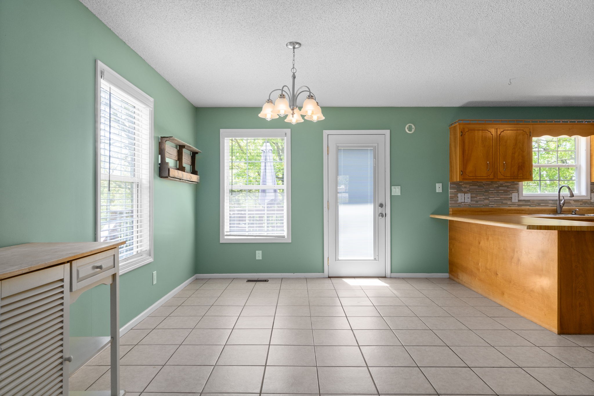 3315 Lylewood Road Woodlawn, TN 37191 - Photo 10 of 39 a view of a kitchen with cabinet and windows