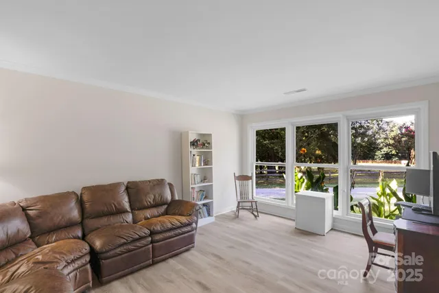 a living room with furniture and window