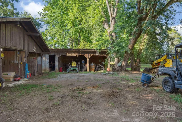 a view of a house with a yard and garage
