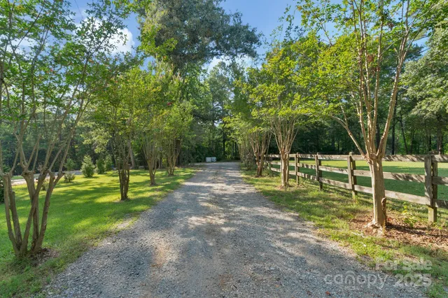 a front view of a house with a yard and a garage