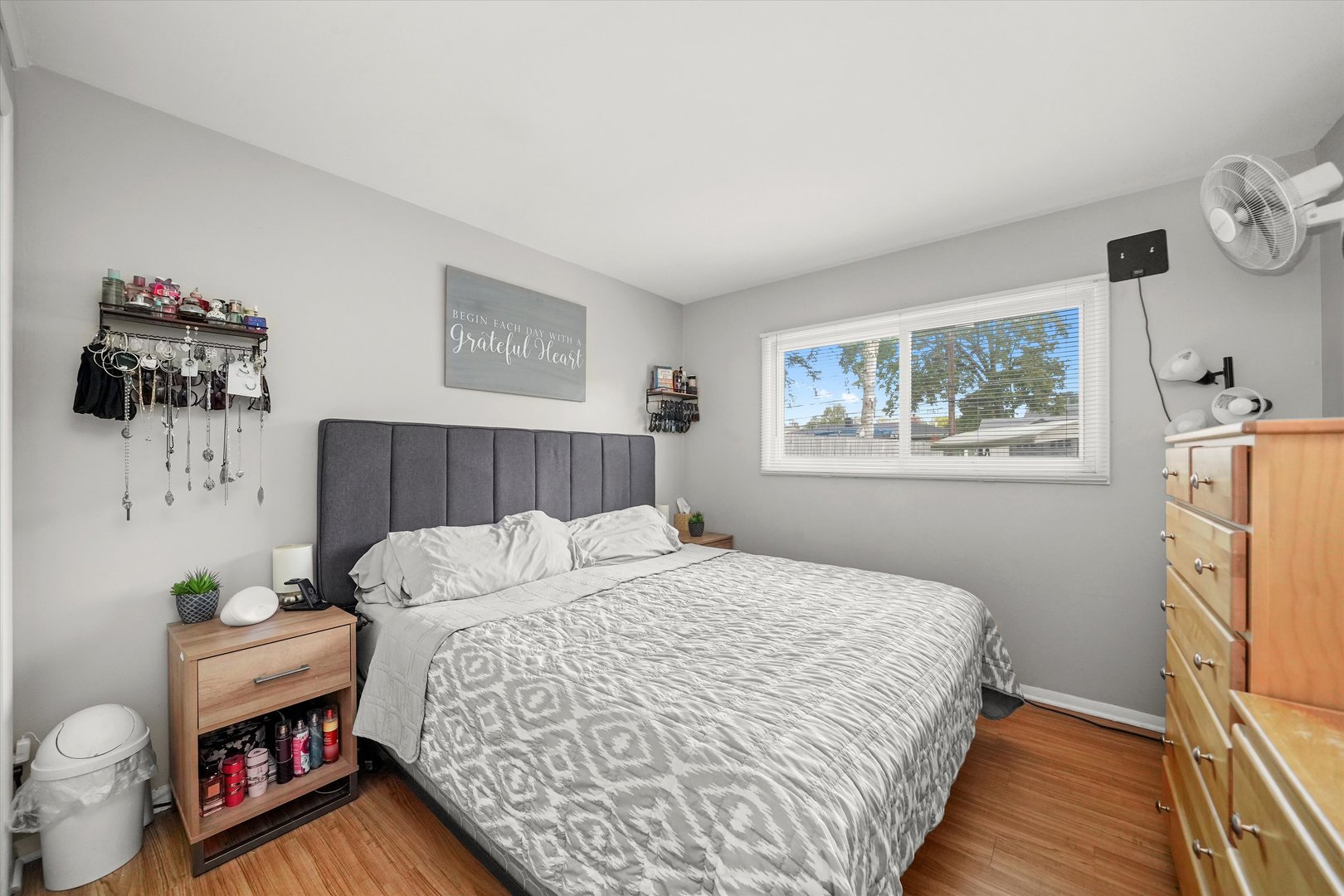 406 Cahill Road Streamwood, IL 60107 - Photo 11 of 22 a bedroom with a bed and wooden floor