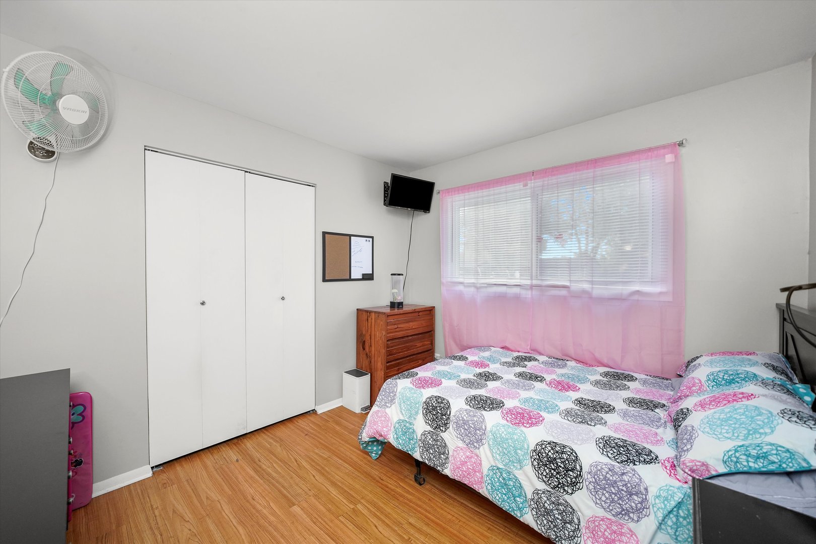 406 Cahill Road Streamwood, IL 60107 - Photo 13 of 22 a bedroom with a bed and wooden floor