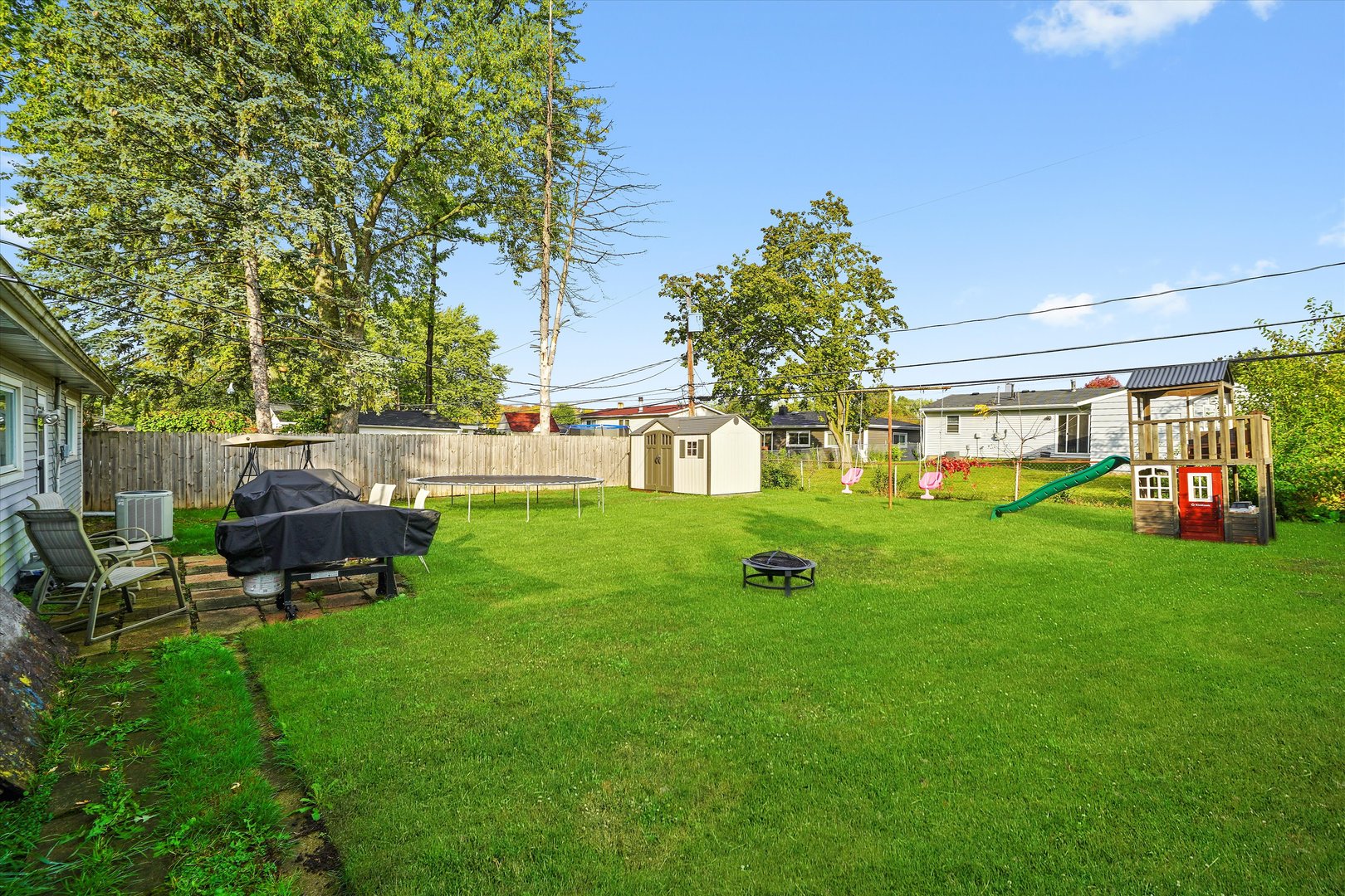 406 Cahill Road Streamwood, IL 60107 - Photo 16 of 22 a view of an house with backyard space and sitting area