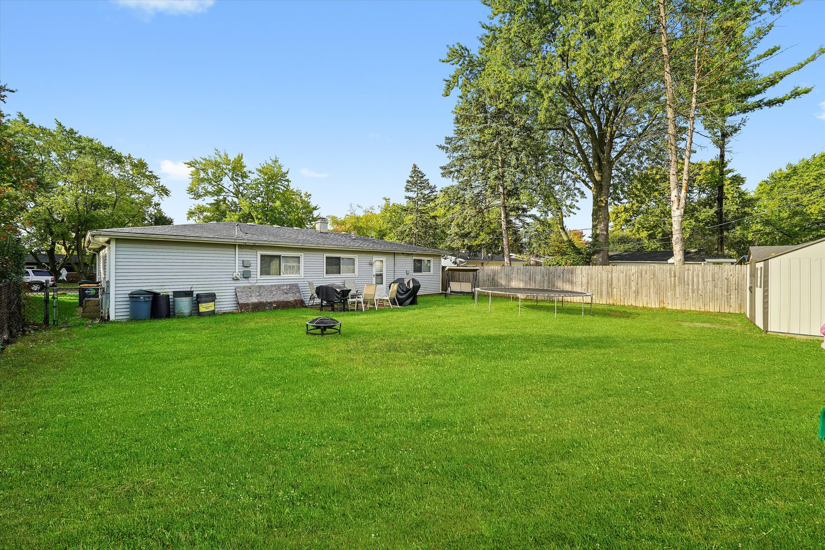 406 Cahill Road Streamwood, IL 60107 - Photo 17 of 22 a view of a house with backyard and a sitting area