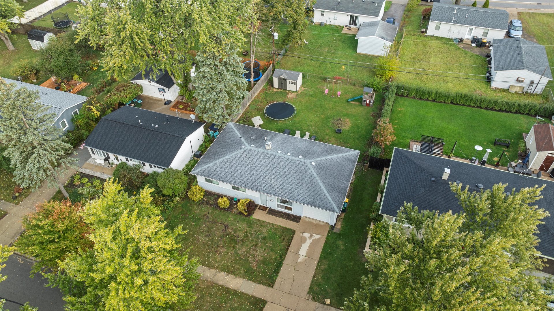 406 Cahill Road Streamwood, IL 60107 - Photo 19 of 22 an aerial view of a house with a yard and lake view
