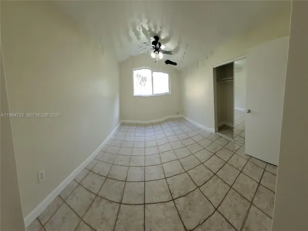 a view of an empty room and window