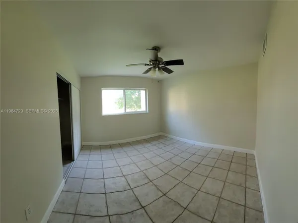 a view of an empty room and window