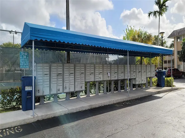 a front view of a building with garage