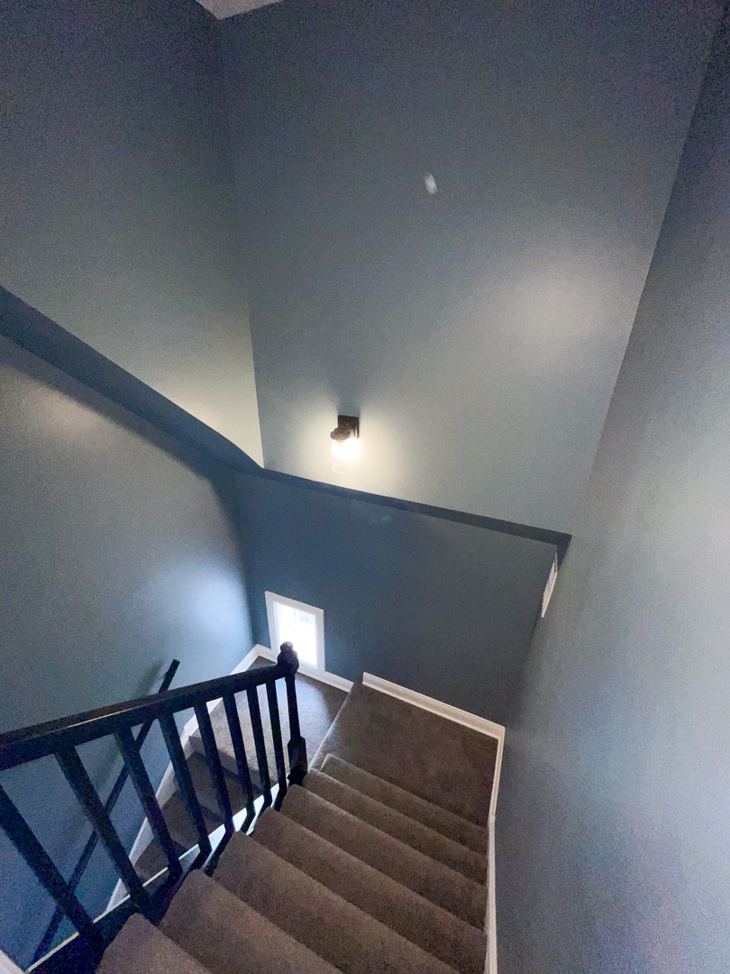7046 South Wabash Avenue Chicago, IL 60637 - Photo 18 of 41 a view of staircase with white walls