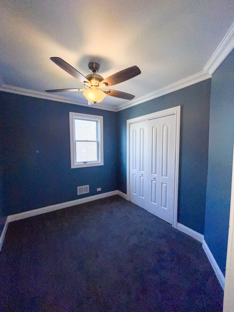 7046 South Wabash Avenue Chicago, IL 60637 - Photo 22 of 41 a view of an empty room with a window