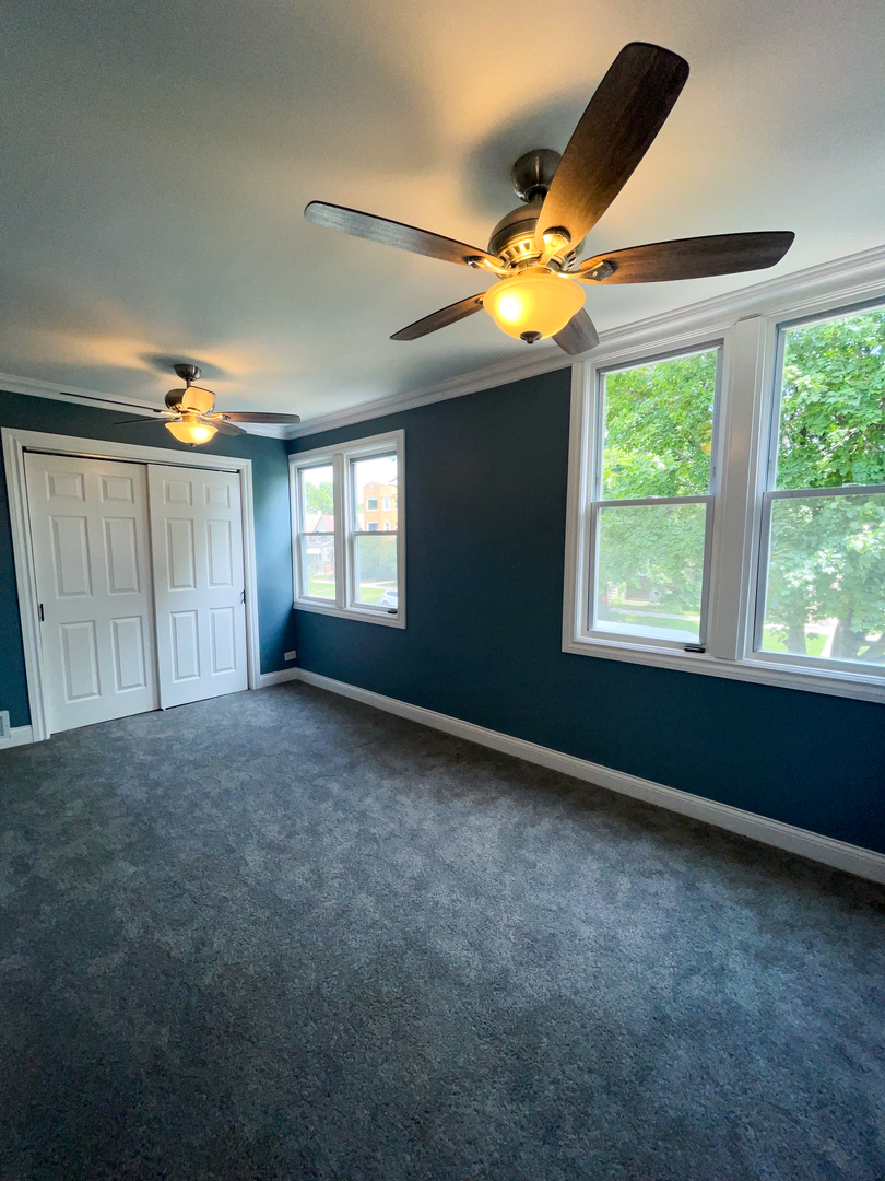 7046 South Wabash Avenue Chicago, IL 60637 - Photo 25 of 41 a view of an empty room with a window and closet