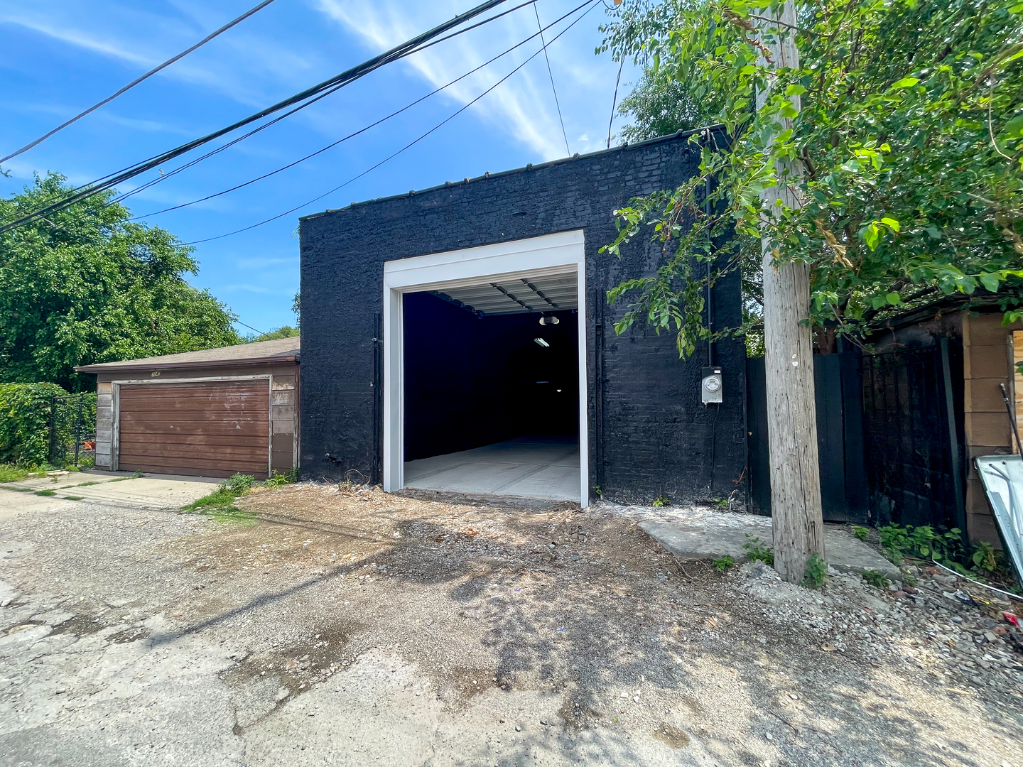 7046 South Wabash Avenue Chicago, IL 60637 - Photo 32 of 41 a view of yellow house with a garage