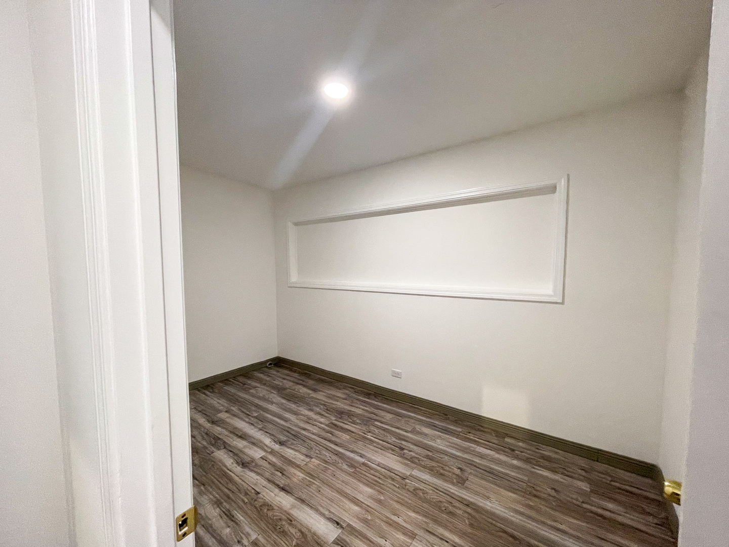 7046 South Wabash Avenue Chicago, IL 60637 - Photo 37 of 41 an empty room with wooden floor and cabinet