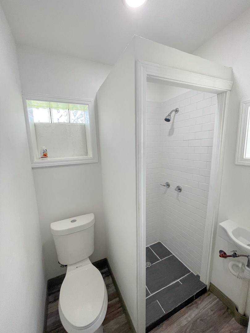 7046 South Wabash Avenue Chicago, IL 60637 - Photo 38 of 41 a bathroom with a toilet and a shower