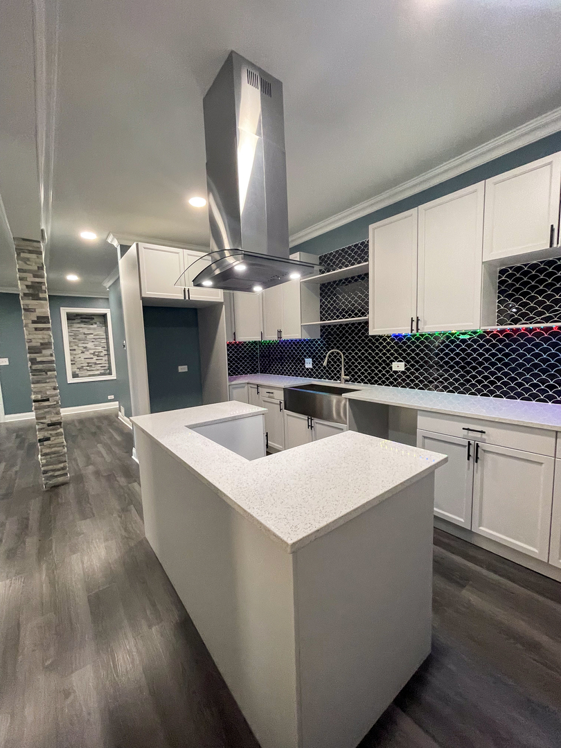 7046 South Wabash Avenue Chicago, IL 60637 - Photo 6 of 41 a kitchen with stainless steel appliances granite countertop a sink a stove and a refrigerator