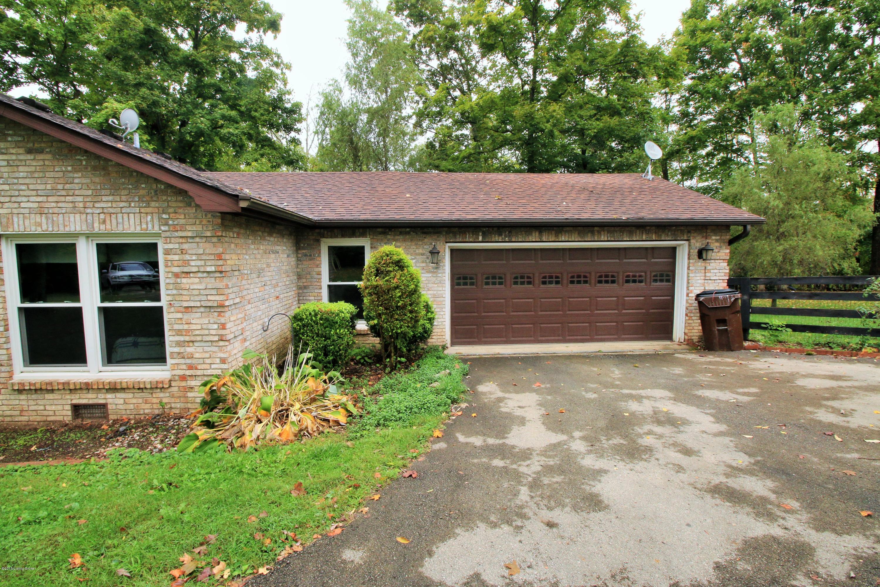 106 Callis Grove Pendleton, KY 40055 - Photo 31 of 36 The driveway approaches the two car garage which allows ample space for parking and storage.