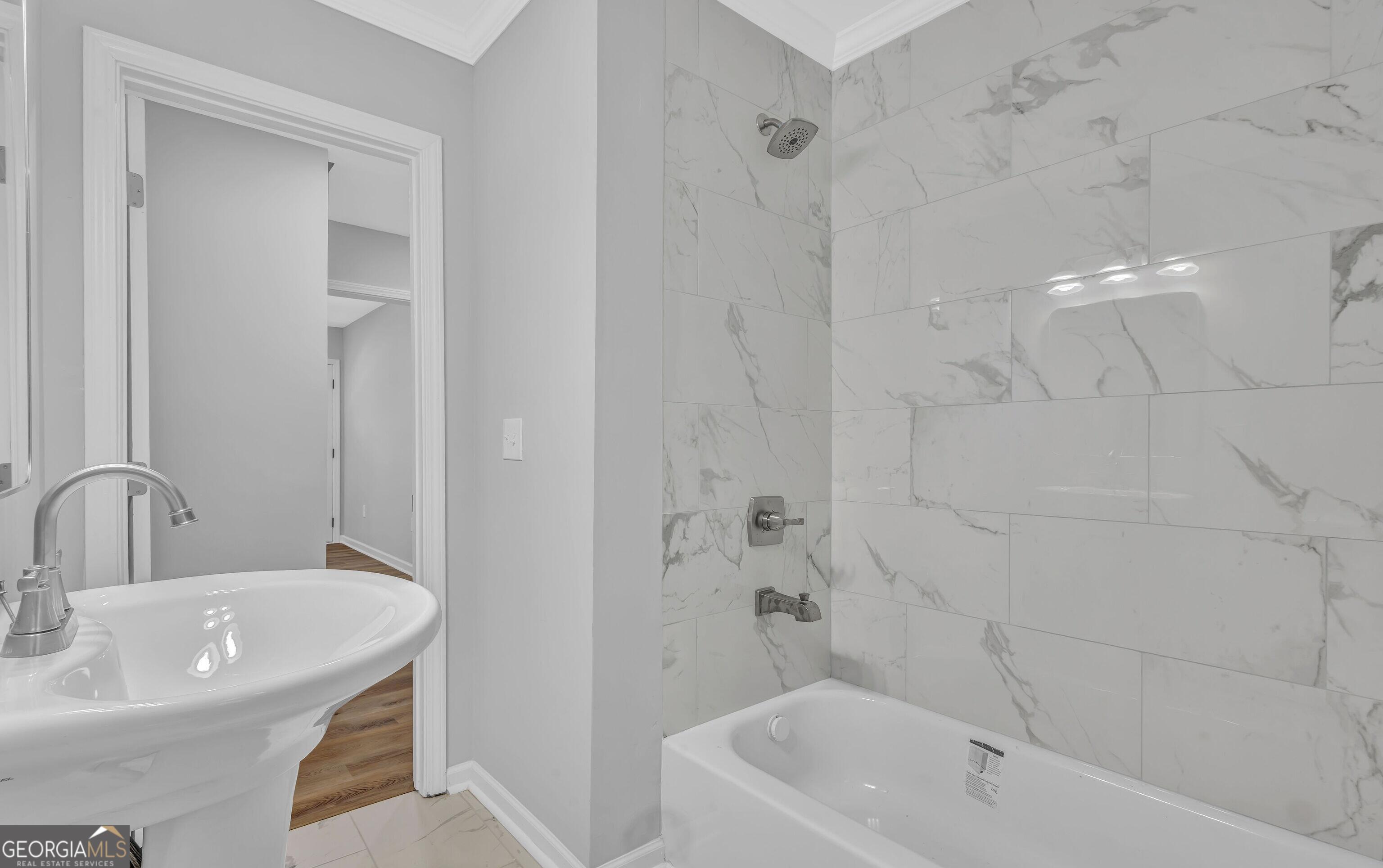 1080 Westmont Road Southwest Atlanta, GA 30310 - Photo 7 of 15 a bathroom with a sink a toilet and shower