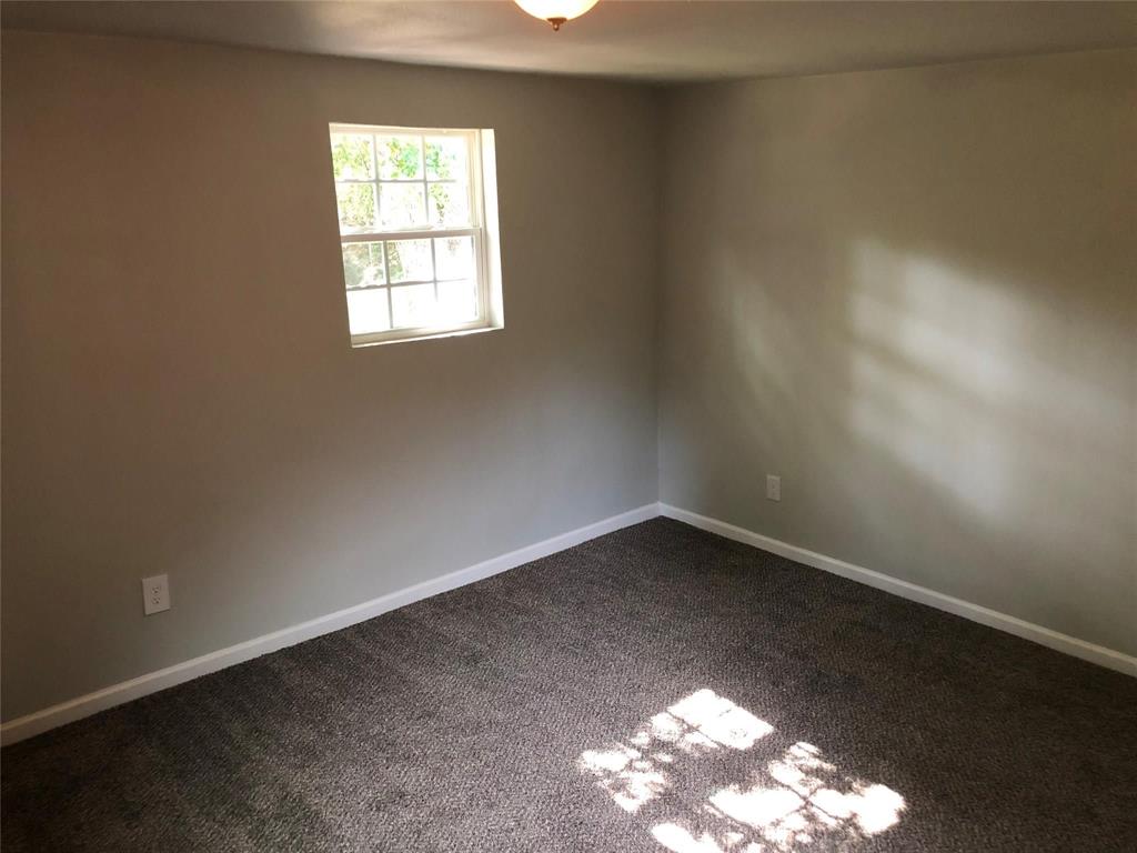 502 South Rusk Street Sherman, TX 75090 - Photo 6 of 15 an empty room with a window