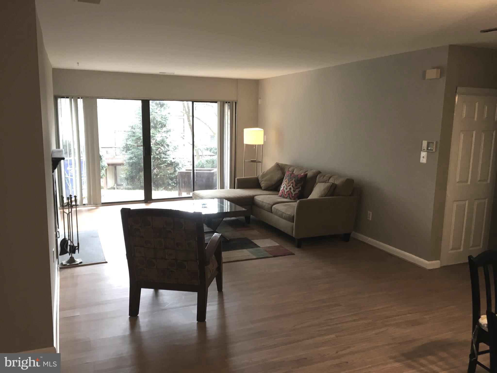 5570 Vantage Point Road, Unit 3 Columbia, MD 21044 - Photo 7 of 14 a living room with furniture and a large window