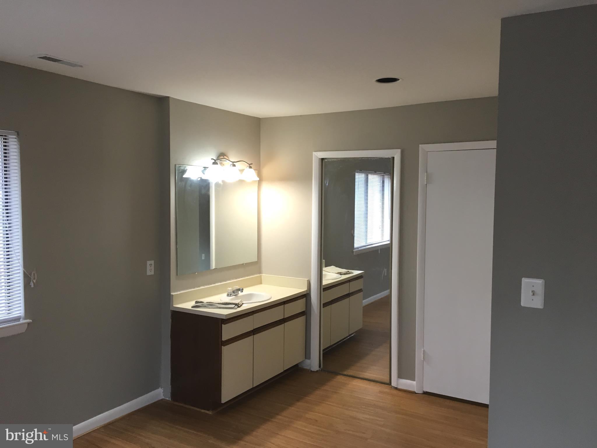 5570 Vantage Point Road, Unit 3 Columbia, MD 21044 - Photo 8 of 14 a kitchen with granite countertop a sink and a stove