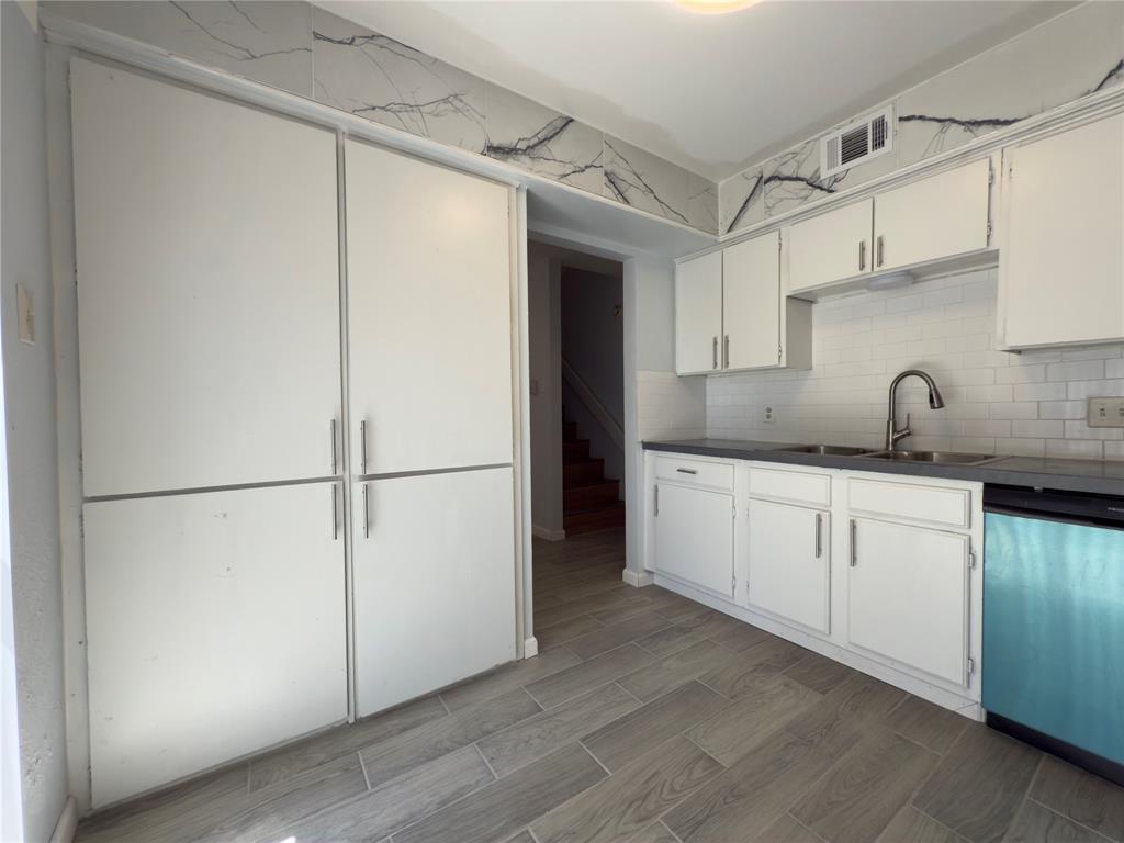 145 Trellis Place Richardson, TX 75081 - Photo 4 of 14 a kitchen with a refrigerator sink and cabinets