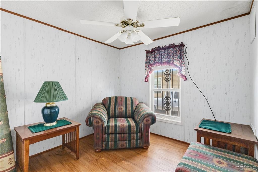 215 South Valley View Road, Unit 15&16 Donna, TX 78537 - Photo 5 of 13 a living room with furniture and a window
