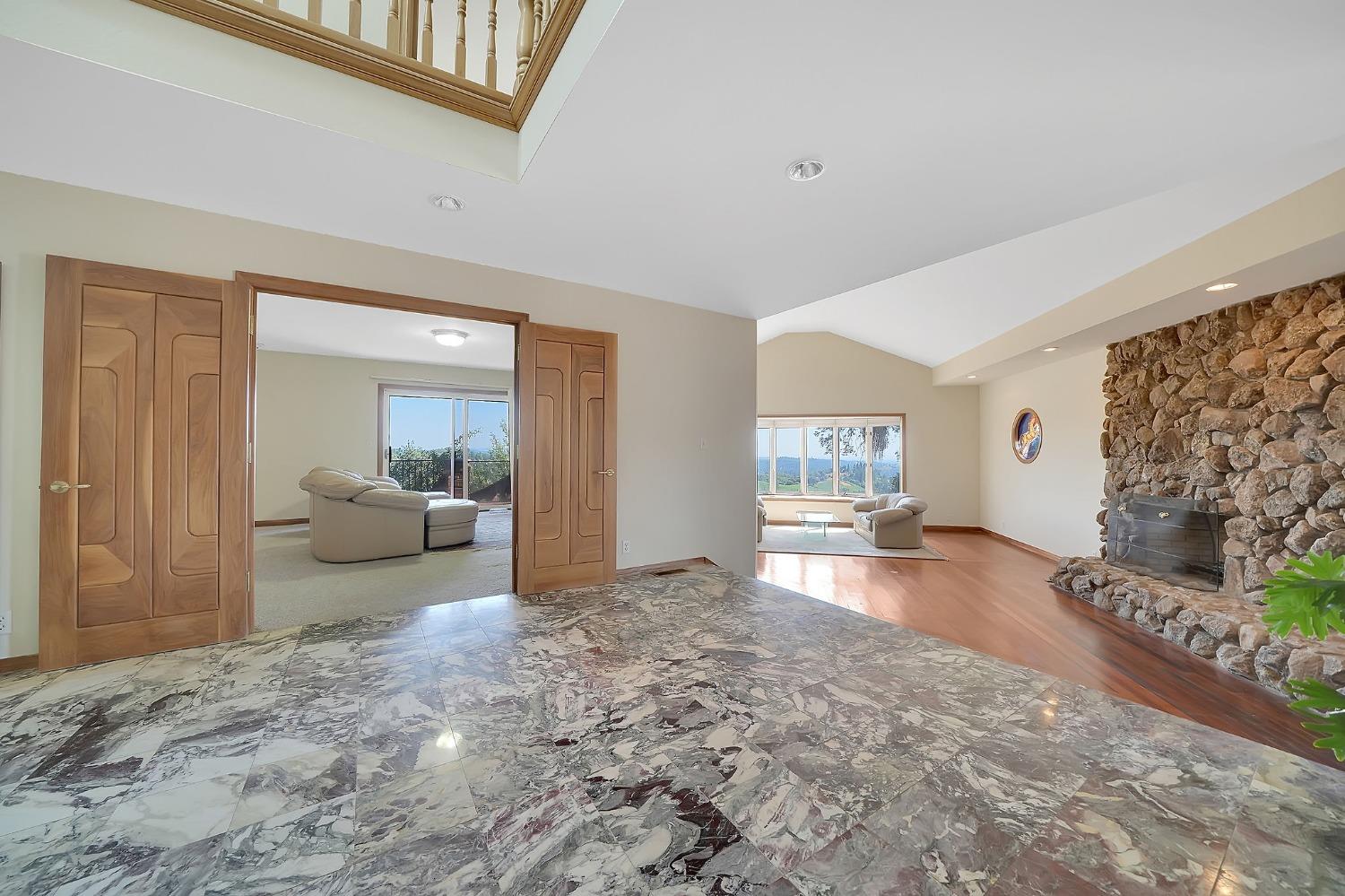 15111 Tyler Road Fiddletown, CA 95629 - Photo 11 of 92 a view of a livingroom with furniture and floor to ceiling window
