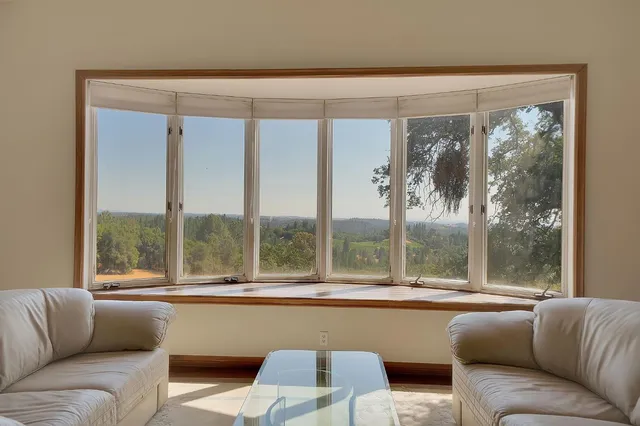 a dining room with furniture and window