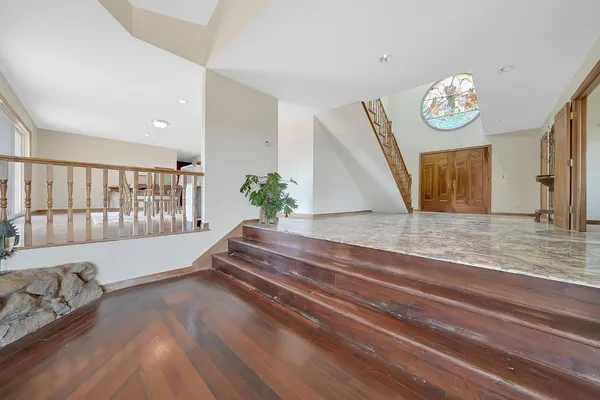 a kitchen with stainless steel appliances granite countertop a refrigerator and a sink