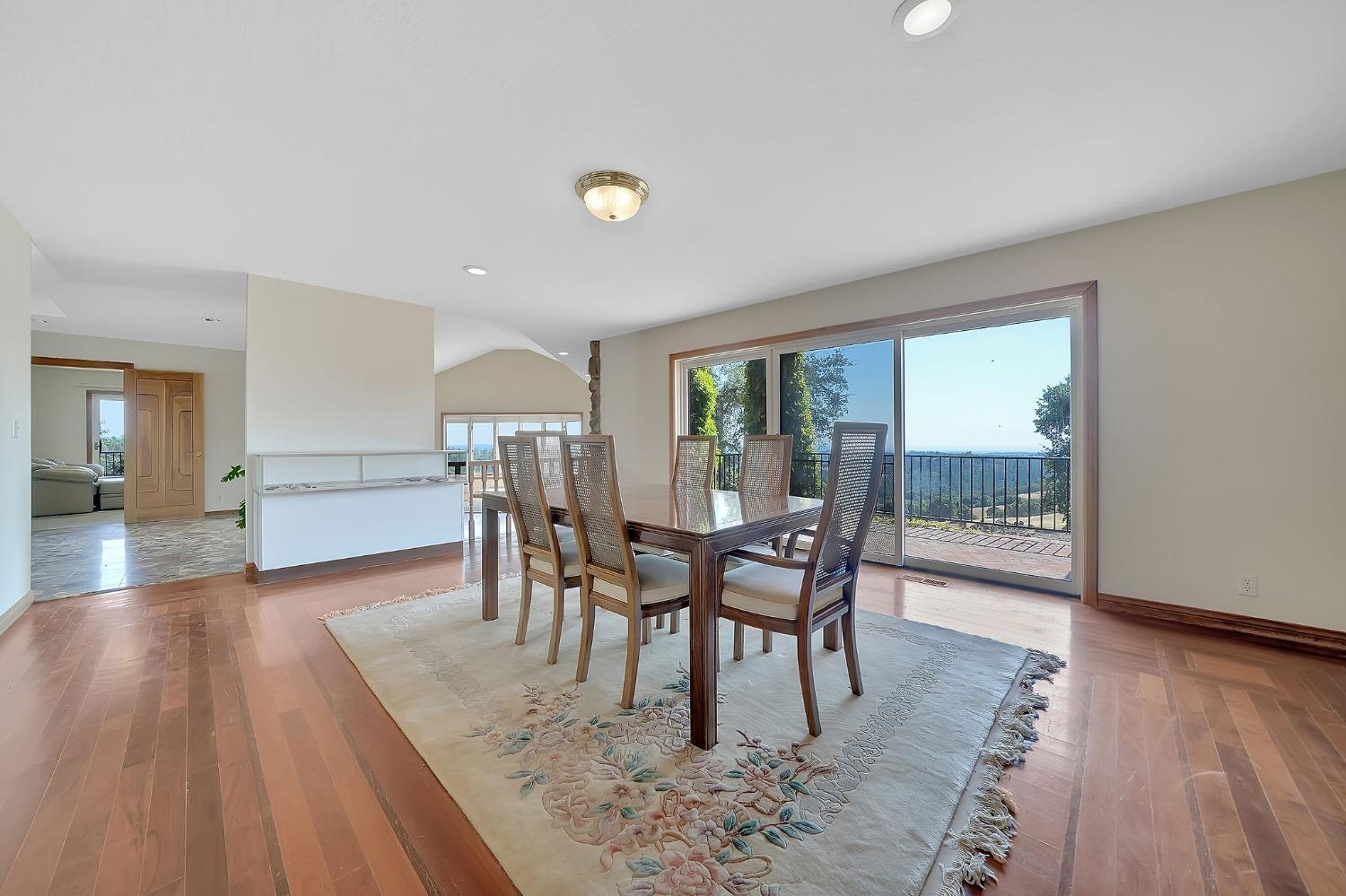 15111 Tyler Road Fiddletown, CA 95629 - Photo 17 of 92 a view of a dining room with furniture and wooden floor