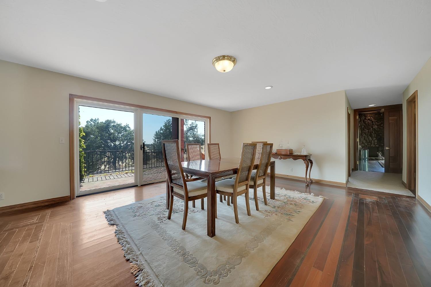 15111 Tyler Road Fiddletown, CA 95629 - Photo 18 of 92 a view of a dining room with furniture and wooden floor
