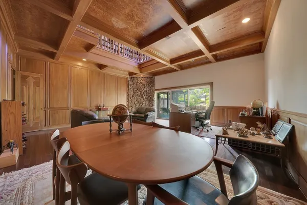 a view of living room with a floor to ceiling window and wooden floor