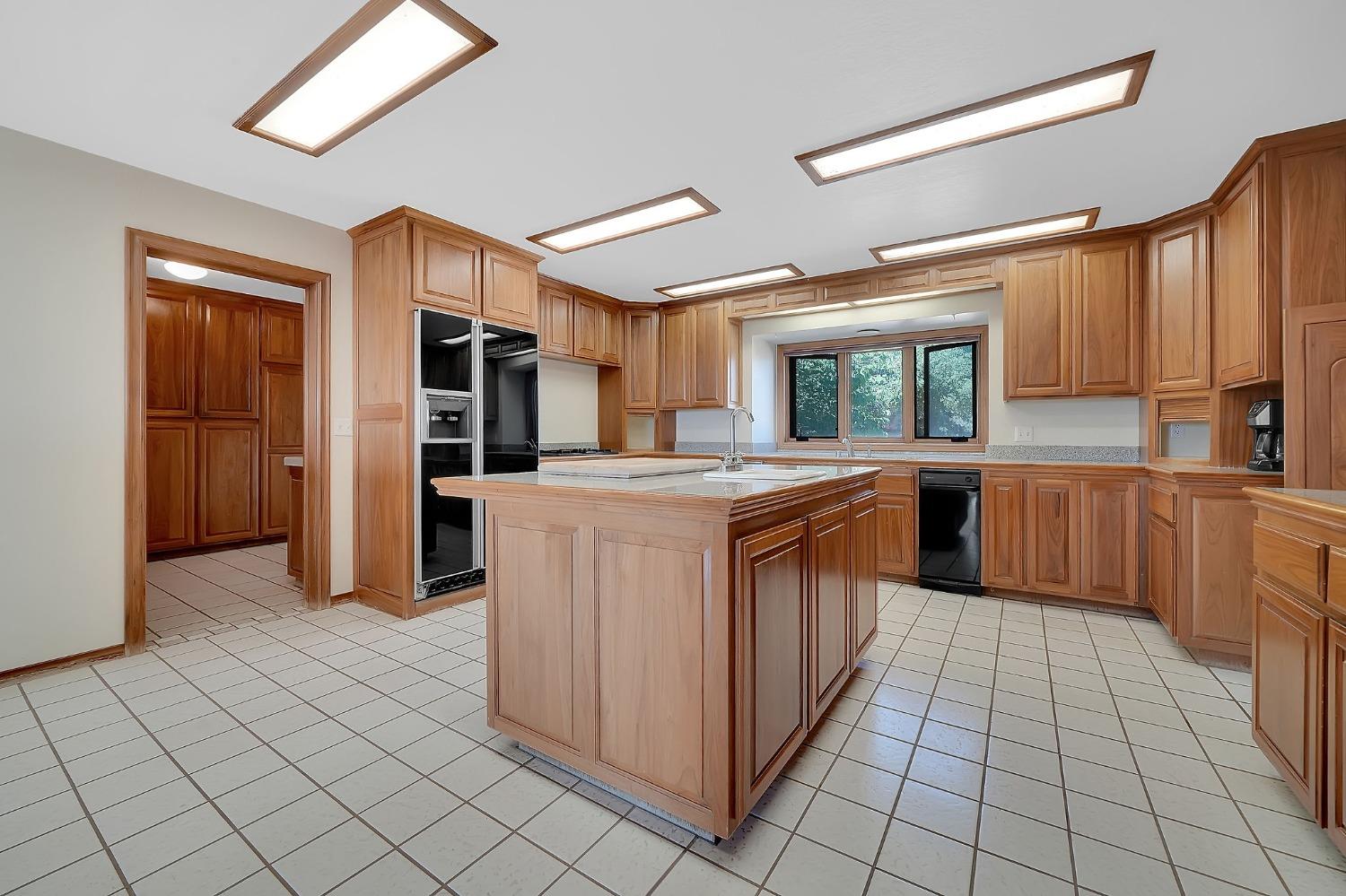 15111 Tyler Road Fiddletown, CA 95629 - Photo 27 of 92 a kitchen with stainless steel appliances granite countertop a refrigerator and a sink
