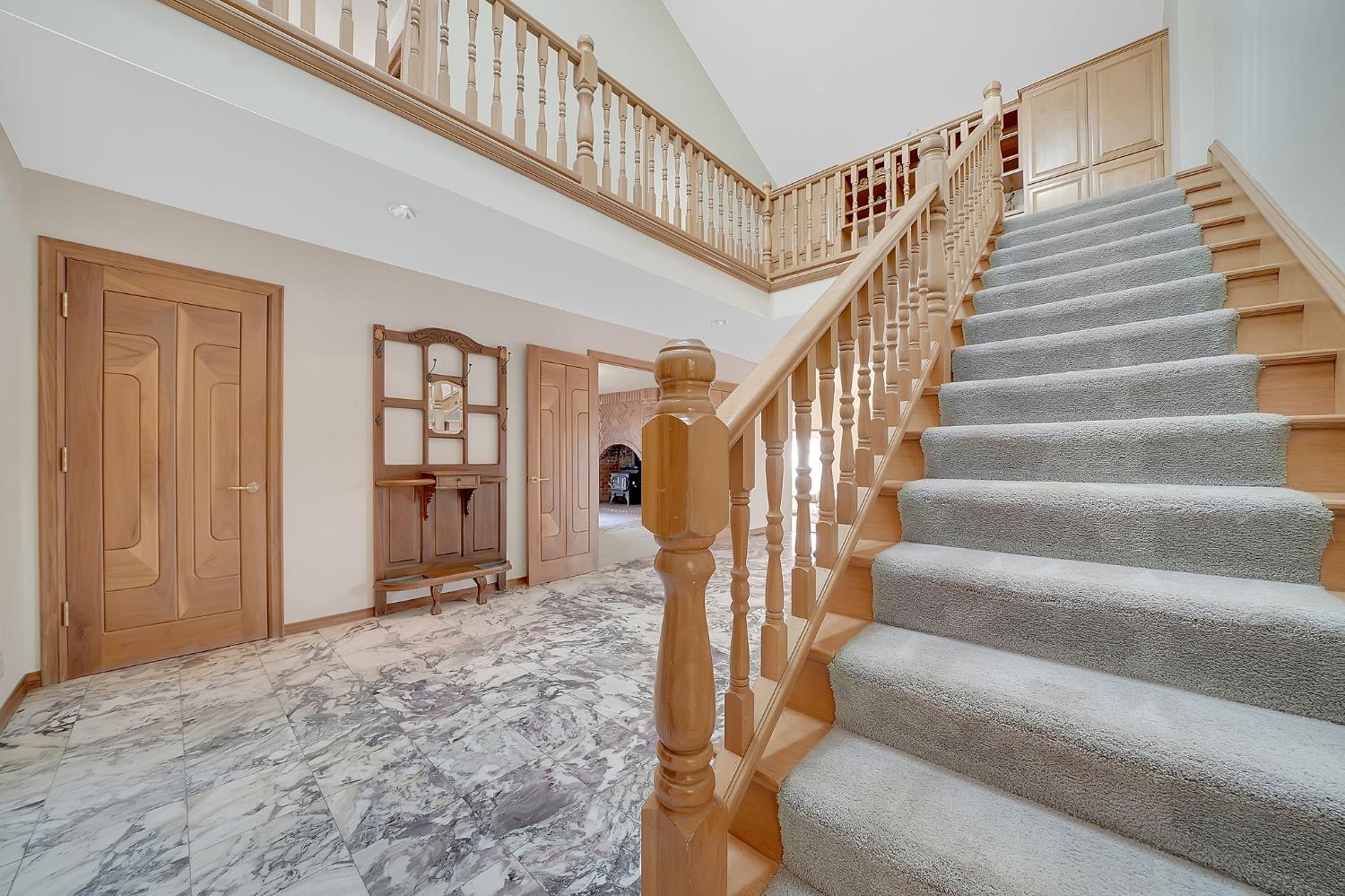 15111 Tyler Road Fiddletown, CA 95629 - Photo 35 of 92 a view of staircase with lots of frames and white walls