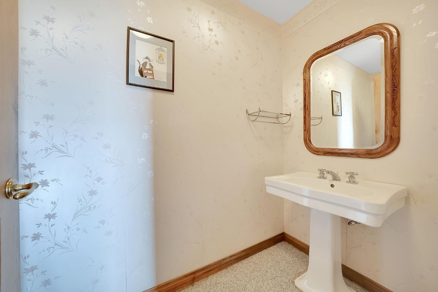 15111 Tyler Road Fiddletown, CA 95629 - Photo 55 of 92 a bathroom with a toilet sink and mirror