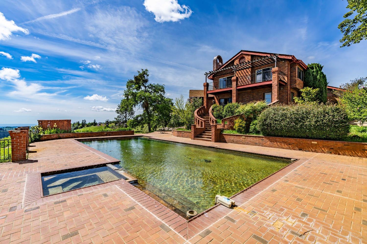 15111 Tyler Road Fiddletown, CA 95629 - Photo 56 of 92 a view of a swimming pool with a lake view