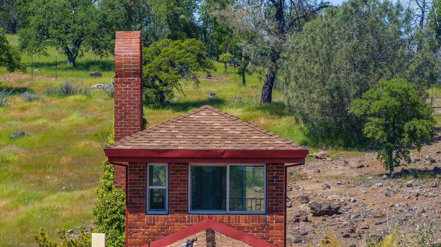 15111 Tyler Road Fiddletown, CA 95629 - Photo 64 of 92 a front view of a house with a garden
